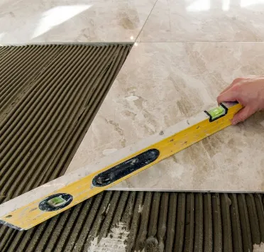 Professional tile installation in progress